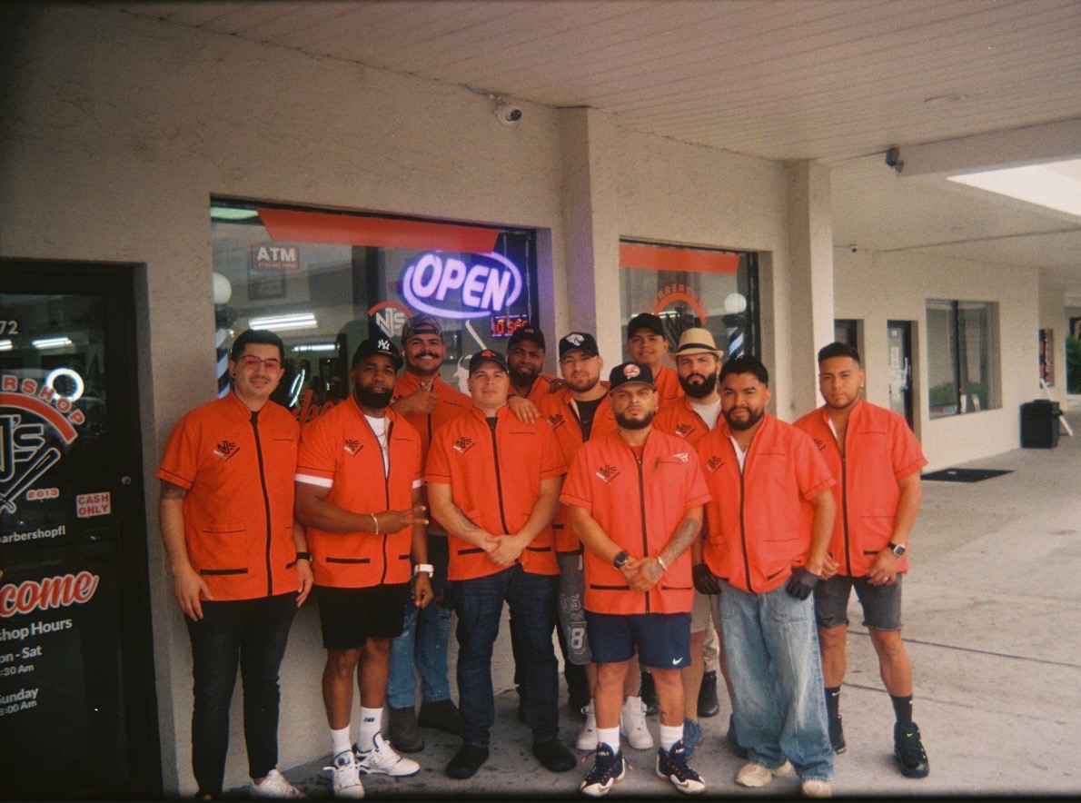 The NJ's Barbershop team outside the shop in Casselberry, Florida